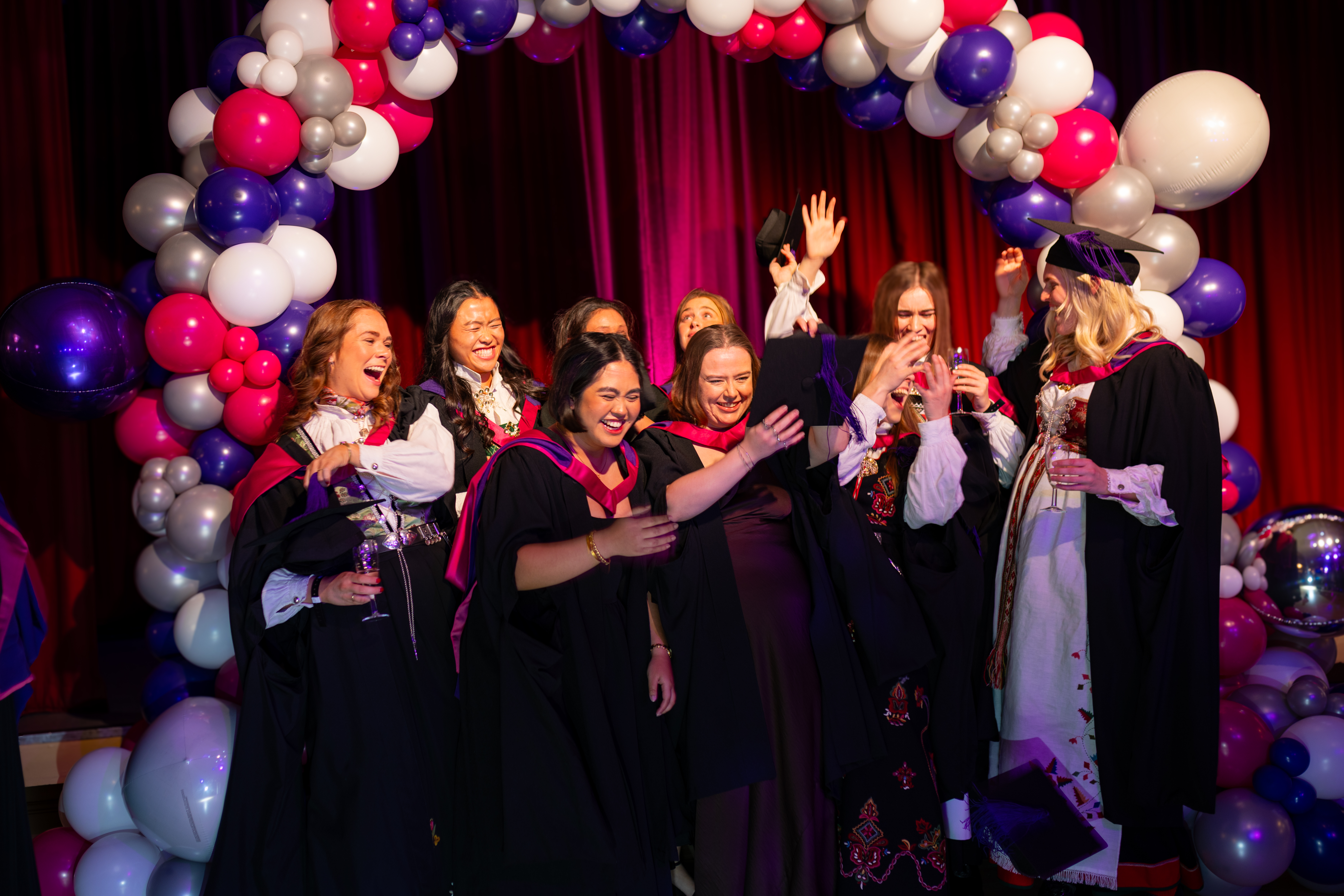 students celebrating graduation.