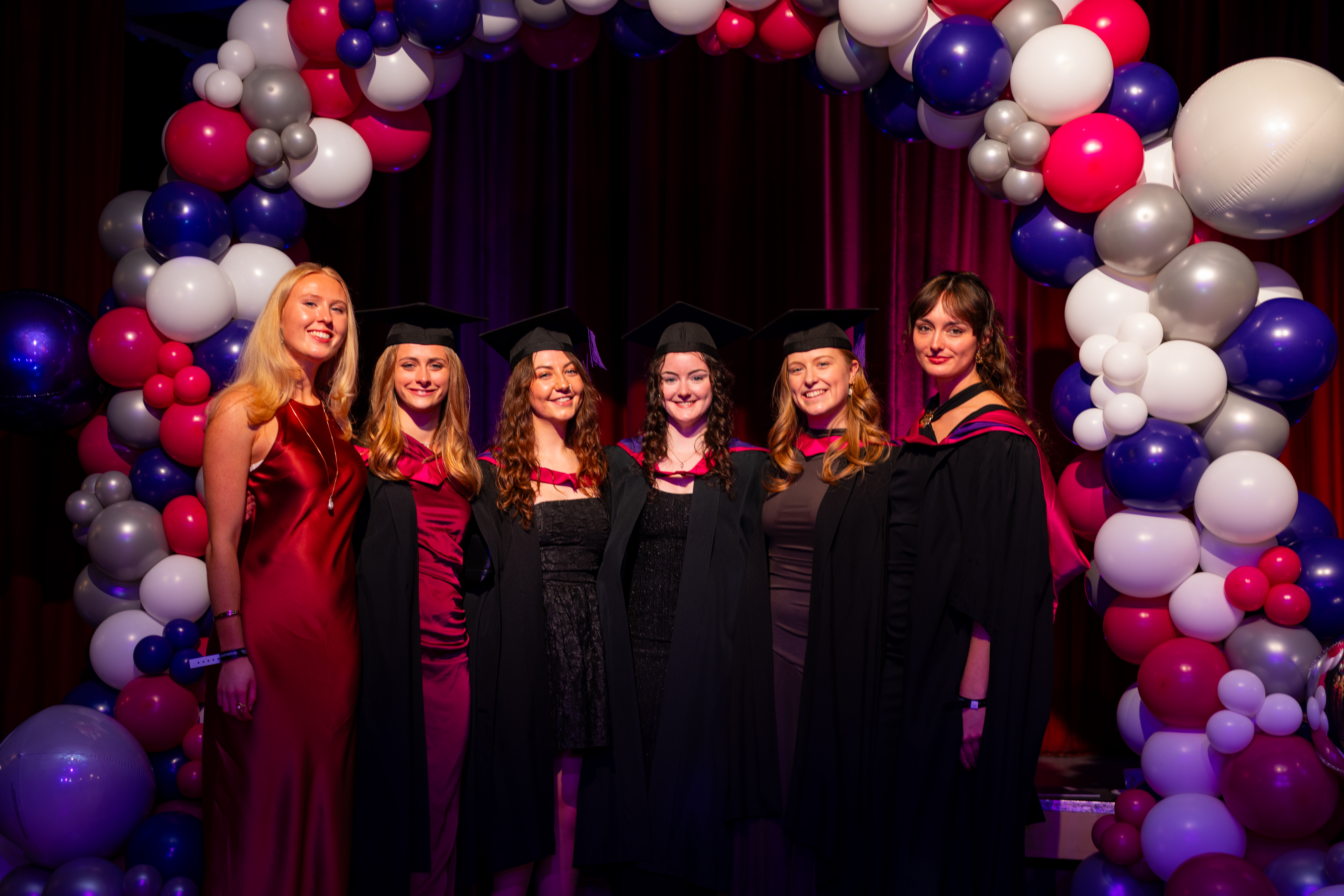 students celebrating graduation.